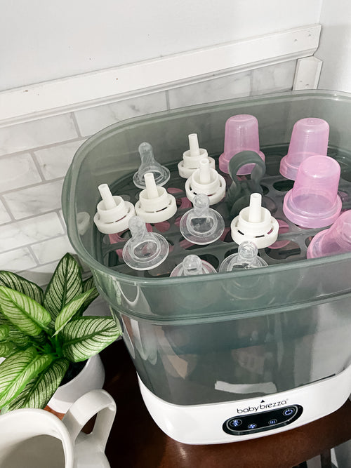 Baby Brezza Sterilizer Dryer open with bottle parts in kitchen - product thumbnail