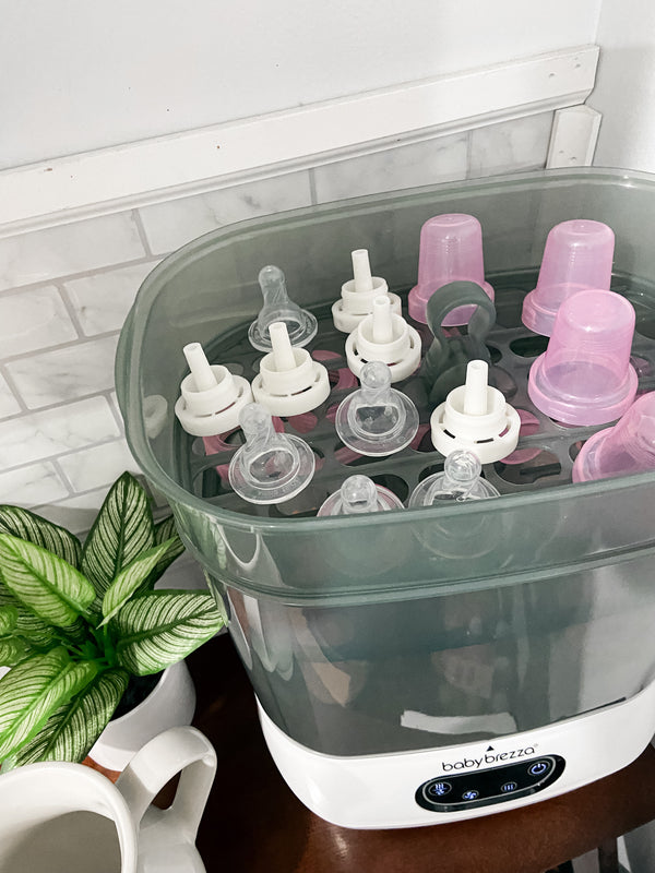 Baby Brezza Sterilizer Dryer open with bottle parts in kitchen - product thumbnail
