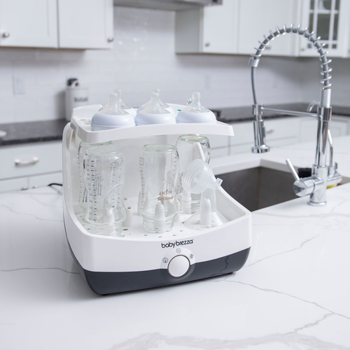 EN Baby Brezza Superfast sterilizer dryer open with bottles and parts in kitchen - product thumbnail