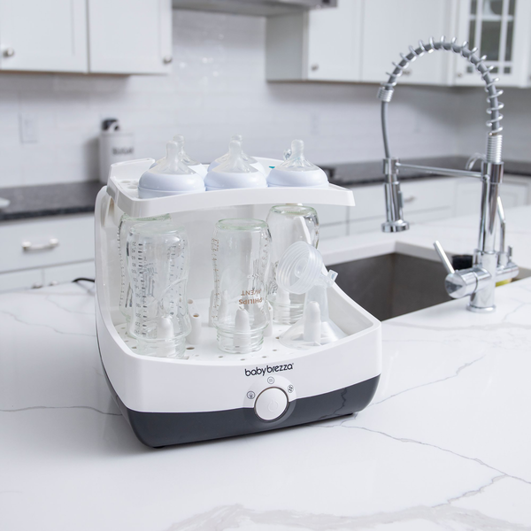 EN Baby Brezza Superfast sterilizer dryer open with bottles and parts in kitchen - product thumbnail