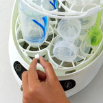 Baby Brezza Detergent tablet being put into the Bottle washer pro  - product thumbnail