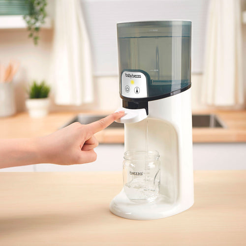 Baby Brezza Instant Water Warmer dispensing water with a touch  - product thumbnail