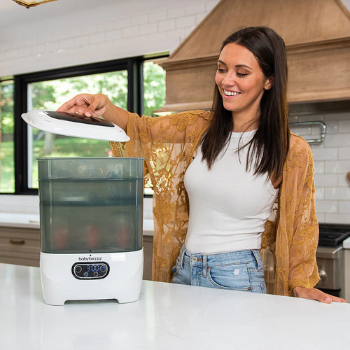 Baby Brezza Sterilizer Dryer opened by a mother in the kitchen - product thumbnail