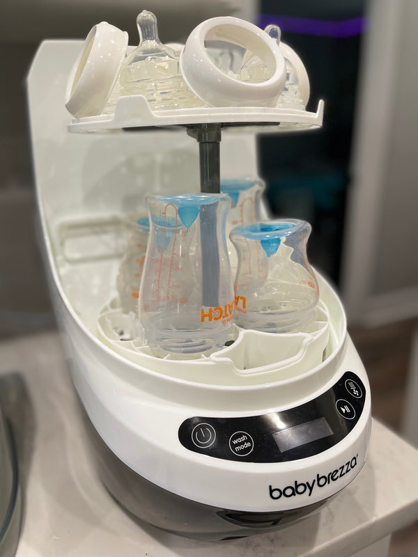 Baby Brezza Bottle washer pro open with bottles and pump parts  - product thumbnail