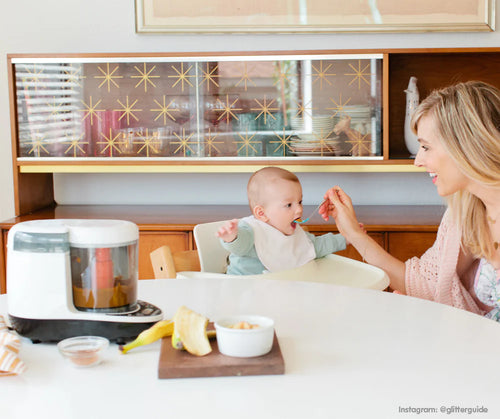 Mother feeding her baby with food prepared using the One Step Food Maker, highlighting its ease of use for fresh and healthy meals - product thumbnail